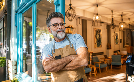 Small business owner in the doorway.