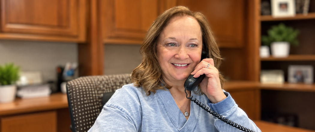 Lady smiling hold phone