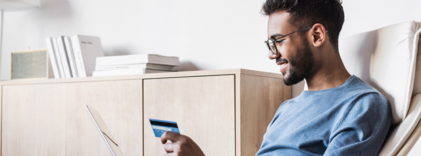 a man making an online purchase with a credit/debit card