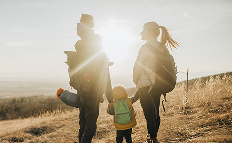 Couple hiking with their children.
