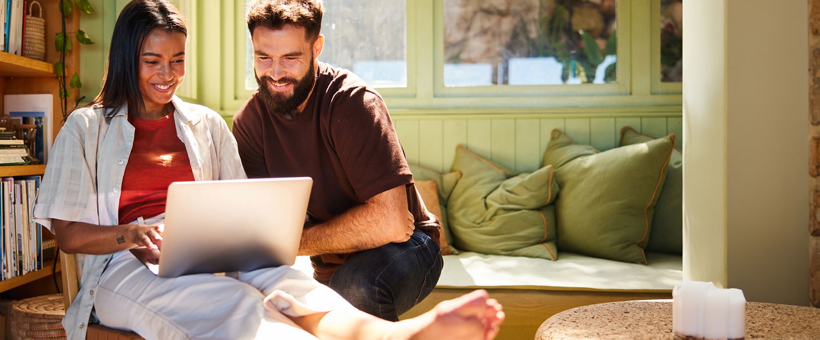 Couple looking at a laptop.